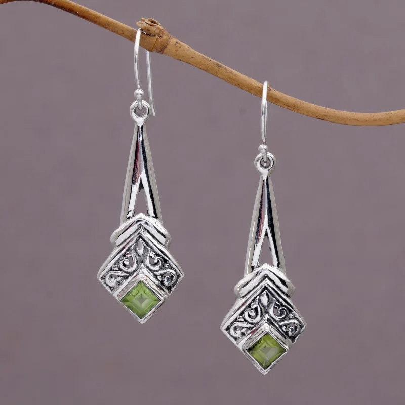 Hoop earrings with heart-shaped frames for a romantic and feminine look-Bali Gleam Peridot and Sterling Silver Dangle Earrings from Indonesia