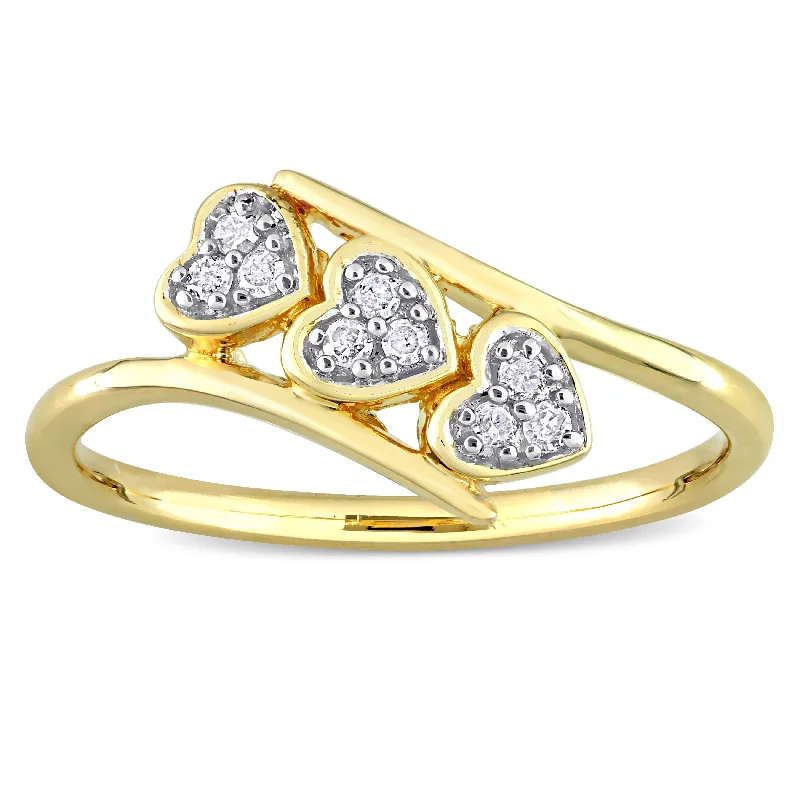 Engagement rings with two-tone sapphire bands -Miadora 1/10ct TDW Diamond Triple Heart Promise Ring in Yellow Plated Sterling Silver