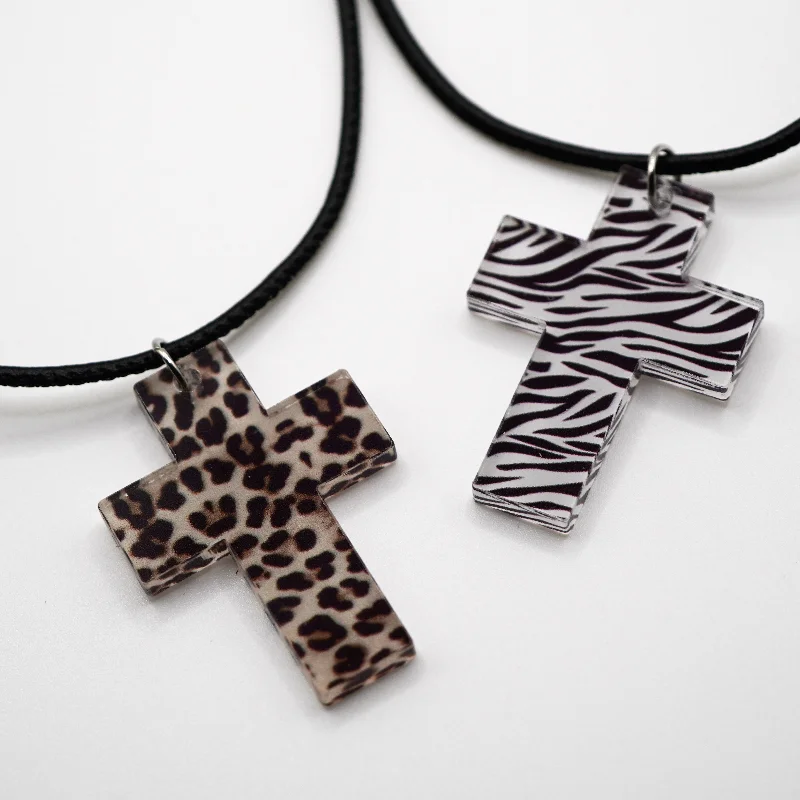 Necklaces and pendants with lotus flower designs for a spiritual, peaceful vibe-Maneater Cross Necklace