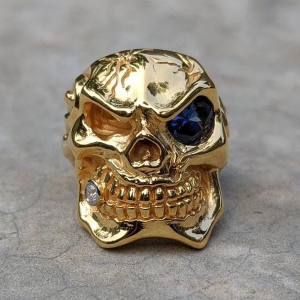 Rings with polished tourmaline for vibrant shine -Micron Yellow Gold Blue Eye Skull Ring